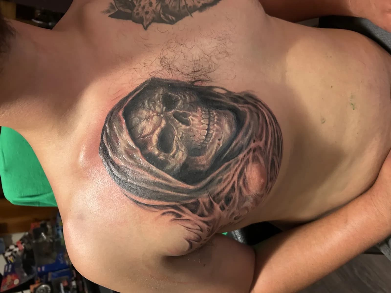 Same hooded skull, full chest context
