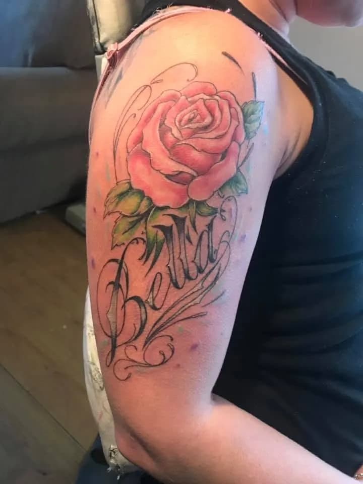 Rose with 'Bella' script, upper arm, colour