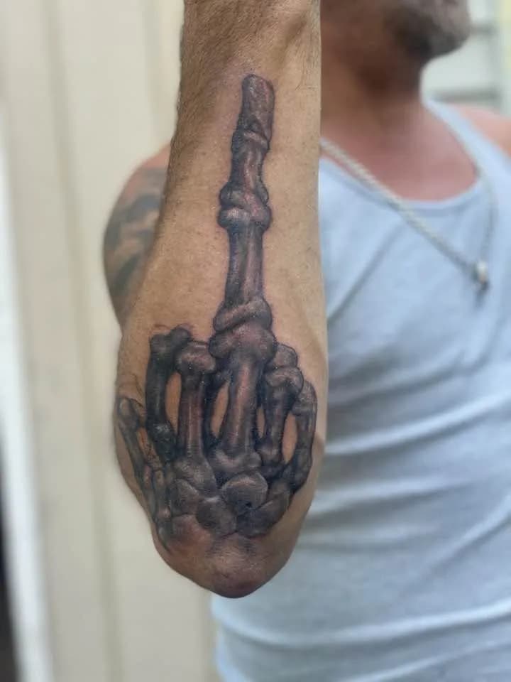 Skeletal hand middle finger, forearm, black & gray